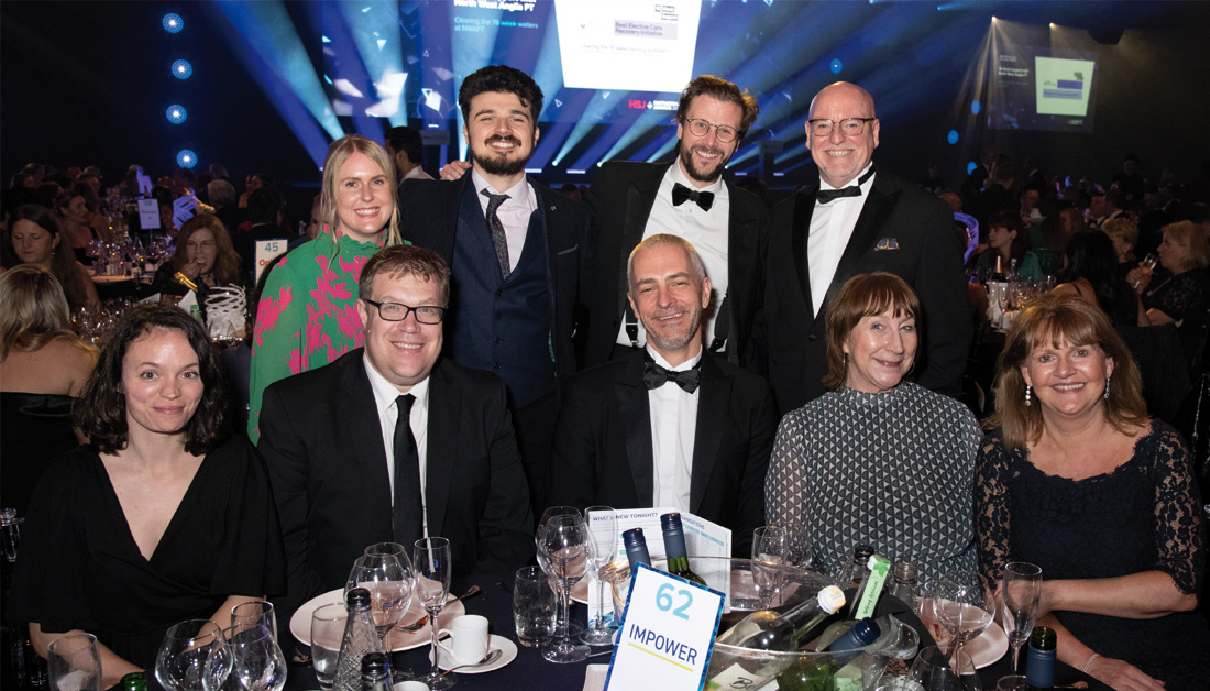 Photograph showing 9 people celebrating at the HSJ Partnership Awards 2024.