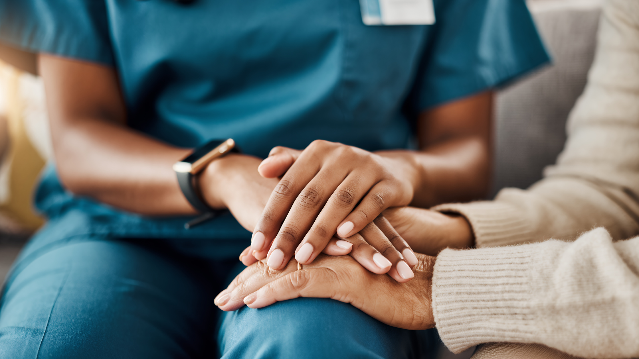 Healthcare worker's hands gently holding an elderly patient's hands, emphasizing empathy and comfort, concept for nursing support, elderly care campaigns and medical consultation